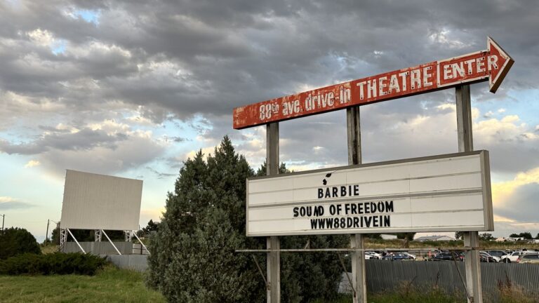 The 88 Drive-In Theatre entrance sign and marquee in Commerce City, Colorado, with the movie screen behind it. Featured image for Kim Monson Newsroom: 88 Drive-In owner says property taxes quadrupled to 0,000 since Gallagher